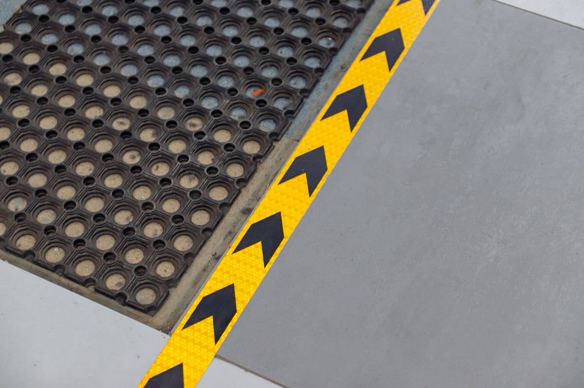 Safety flooring with directional markings