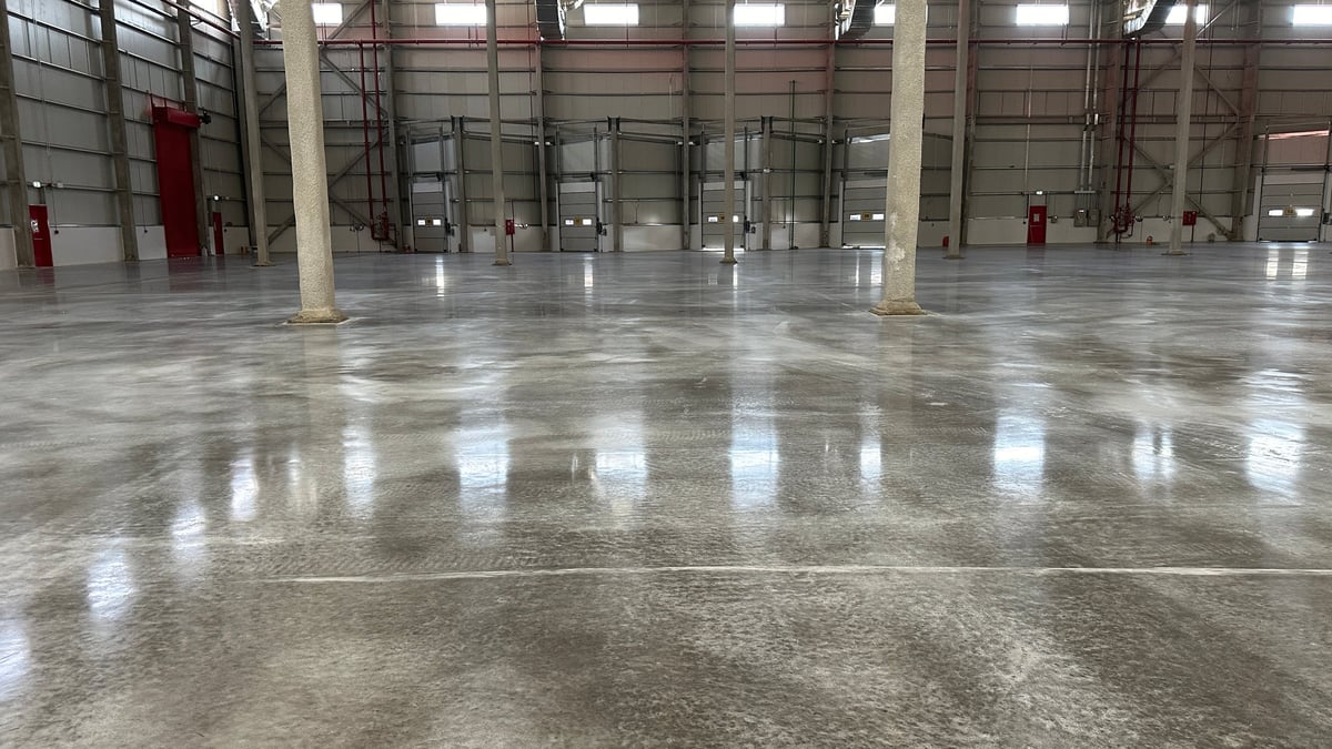 Modern industrial warehouse with clean epoxy flooring